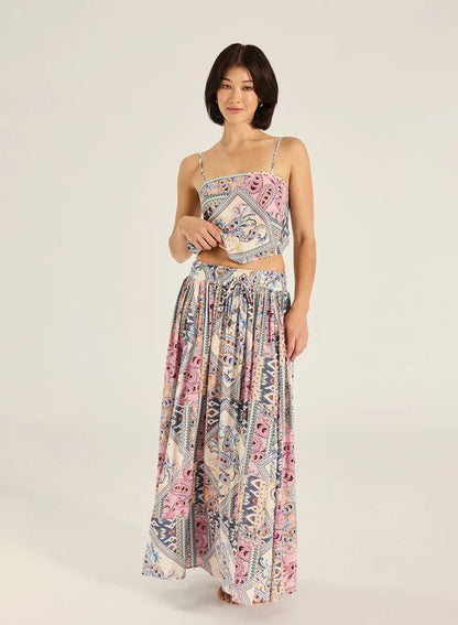 Step into effortless elegance with the Malina Maxi Skirt. Crafted from a luxe 100% viscose fabrication with subtle gold lurex stripe detailing, it features a comfortable shirred waistband and a self-tie finished with gold bead accents. A timeless addition to your wardrobe, this piece makes a refined yet striking impression.

Product Details:

Soft, Breathable Mesh Fabrication
Lurex stripe detail
Shirred Waistband With metal bead  Finish
Maxi length