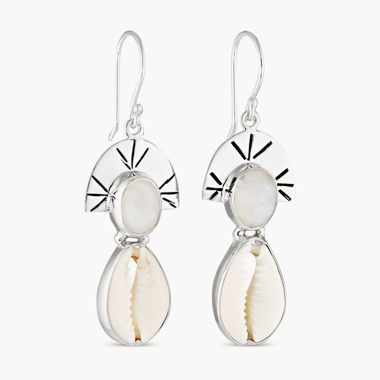 Handcrafted from sterling silver, the Moonstone Eclipse Cowrie Drops offer a crescent moon cast around an oval moonstone with a drop cowrie shell set in silver. Moonstone is associated with femininity, spirituality, and intuition.
