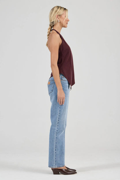 Sleek halter top crafted with a flattering bias cut to skim the body
Features a high neckline and a striking asymmetrical hem
Modern design inspired by 90s minimalism
Designed for effortless, elevated styling
Perfect for pairing with vintage-inspired denim for a night out
Made with 100% Acetate