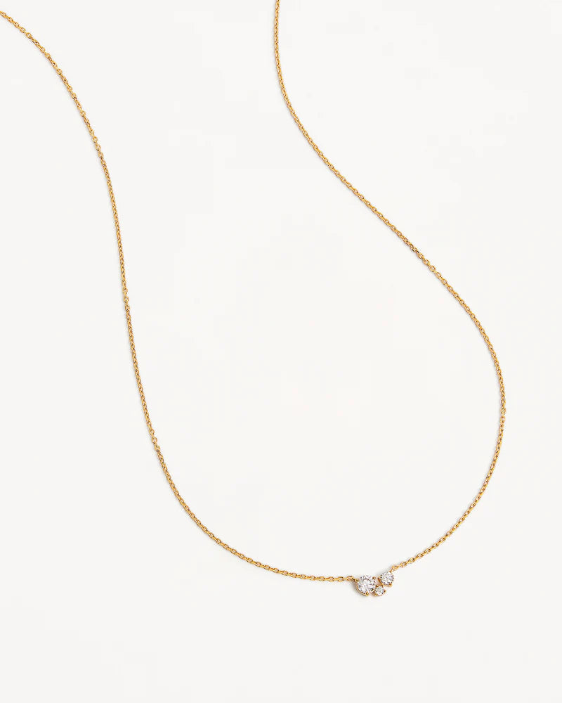 The&nbsp;Whispers of Love Necklace&nbsp;features a classic trio design with an asymmetrical twist&nbsp;with&nbsp;varying sizes of round-cut crystals.&nbsp;This piece is a&nbsp;visual poem to the simplicity of love - and all the quiet magic it holds.&nbsp;It’s&nbsp;classic and delicate design&nbsp;is the perfect subtle touch of sparkle for the&nbsp;bride&nbsp;looking to shine in her own light.&nbsp;