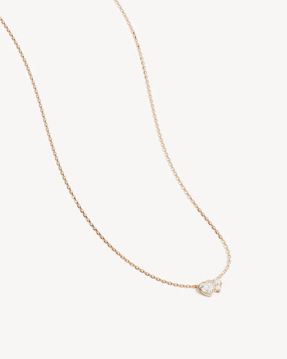 By Charlotte - The Dream Lover Heart Necklace speaks to the unspoken connections and the in-between moments of utmost intimacy. The delicate heart cluster design encapsulates the dreamy moments of tender love and connections we hold closest to our hearts.&nbsp;

18k Gold Vermeil: 2.5 microns of 18 carat gold coating a sterling silver base.&nbsp;

Necklace length: 18 inches (45.72cm).&nbsp;

Features a silicon ball slider to customise length.&nbsp;

Pendant: 9 x 6mm.&nbsp;

Set with heart and round cut cubic