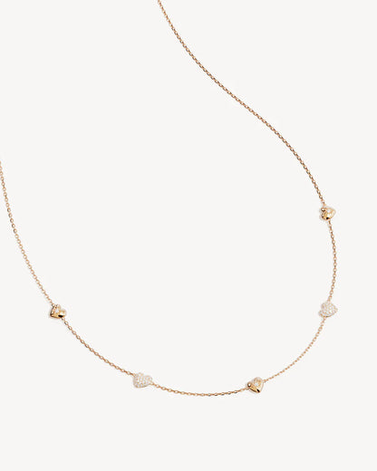 By Charlotte -&nbsp;The You Have My Heart Charm Choker is a joyful and sparkling proclamation of love and connection, re-imagining the heart motif into a playful charm design featuring alternating crystal encrusted pendants. Wear this design as a reminder of the love that surrounds, enriches, and strengthens you every day. &nbsp;

18k Gold Vermeil: 2.5 microns of 18 carat gold coating a sterling silver base.&nbsp;

Hearts are puffy and asymmetrical.&nbsp;
