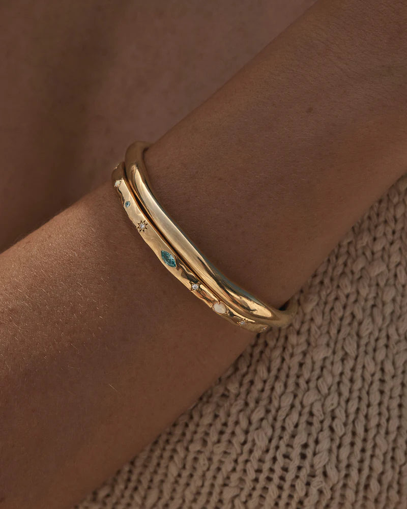 Breathe new life into the new year with the&nbsp;Hope and Protection Cuff. Set with&nbsp;cubic&nbsp;zirconias&nbsp;and lab-grown opals, our luminous evil eye will&nbsp;assist&nbsp;you in shedding all that does not serve you, allowing you to move into the new year with purpose and peace. This keepsake is perfect for gifting, traditionally gifted to imbue the wearer with luck and protection.&nbsp;