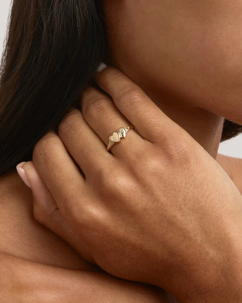 Vintage and keepsake&nbsp;inspired,&nbsp;the&nbsp;Forever Intertwined Heart Signet Ring&nbsp;features a&nbsp;traditional engraving detailing with a lotus bloom twist. A nostalgic design that reminds us of the bonds that are forever embedded in our hearts and the memories that will forever connect us.&nbsp;Available in 18k gold vermeil and&nbsp;925&nbsp;sterling silver.&nbsp;&nbsp;