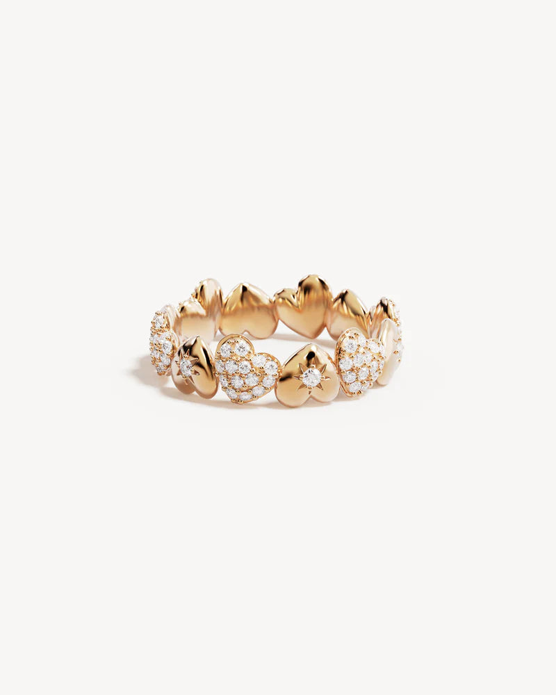By Charlotte - The You Have My Heart Band Ring is a joyful and sparkling proclamation of love and connection, re-imagining the heart motif into a playful charm design featuring alternating crystal encrusted pendants. Wear this design as a reminder of the love that surrounds, enriches, and strengthens you every day.&nbsp;

18k Gold Vermeil: 2.5 microns of 18 carat gold coating a sterling silver base.&nbsp;

Band ring design featuring alternating hearts.&nbsp;

Set with cubic zirconias in claw and pavé settin