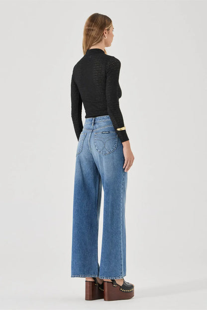 The Relaxed Sailor is a high-rise fit featuring a relaxed, A-line wide leg. Designed to sit loose and off the body, this long-length silhouette is finished with front scoop pockets and our signature spade back pockets with deck stitching