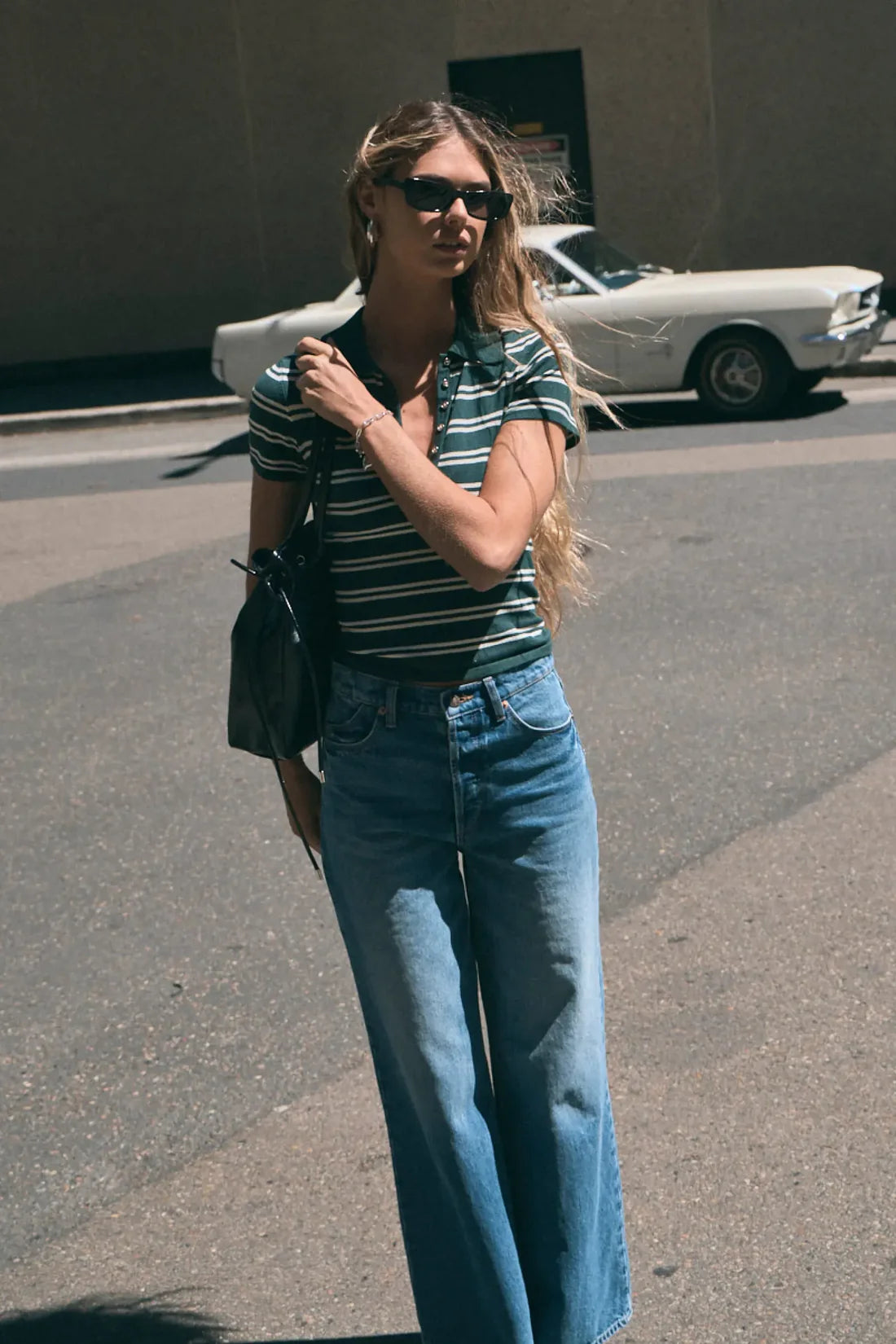 The Relaxed Sailor is a high-rise fit featuring a relaxed, A-line wide leg. Designed to sit loose and off the body, this long-length silhouette is finished with front scoop pockets and our signature spade back pockets with deck stitching