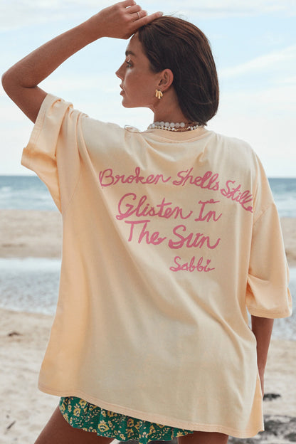 Shells Out, Worries Gone

Meet the Sabbi Very Oversized Shell Titty Tee, your go-to for carefree beach days and playful, sun-soaked vibes. Perfect for beach babes who love a little flirt, a lot of fun, and effortless style, this tee brings relaxed, breezy energy to every outfit.
