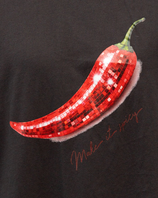 The Make It Spicy Tee is your throw-on-and-go statement piece — featuring an oversized relaxed fit and playful chilli graphic with a subtle retro feel. Crafted from soft 100% cotton in a washed black finish, it’s the kind of tee that looks even better styled back with lived-in denim, relaxed tailoring or cut-off shorts.

Designed with an effortless boyfriend-inspired silhouette, this tee is perfect half-tucked, layered or worn oversized for that undone cool-girl feel.

100% Cotton
Oversized relaxed fit
Vint