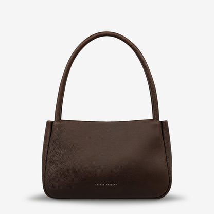 If you think about something in the cold light of day, you think about it clearly and calmly without emotion. In much the same way, the 'Light of Day' handbag isn't caught up with unnecessary, over the top design features. With its more structured form and thoughtful simplicity the LOD bag makes for the perfect day to night bag. With generous straps it can be comfortably worn over the shoulder or elbow and features a wide opening main compartment, with zipper pocket, open pockets, and clip for your keys.