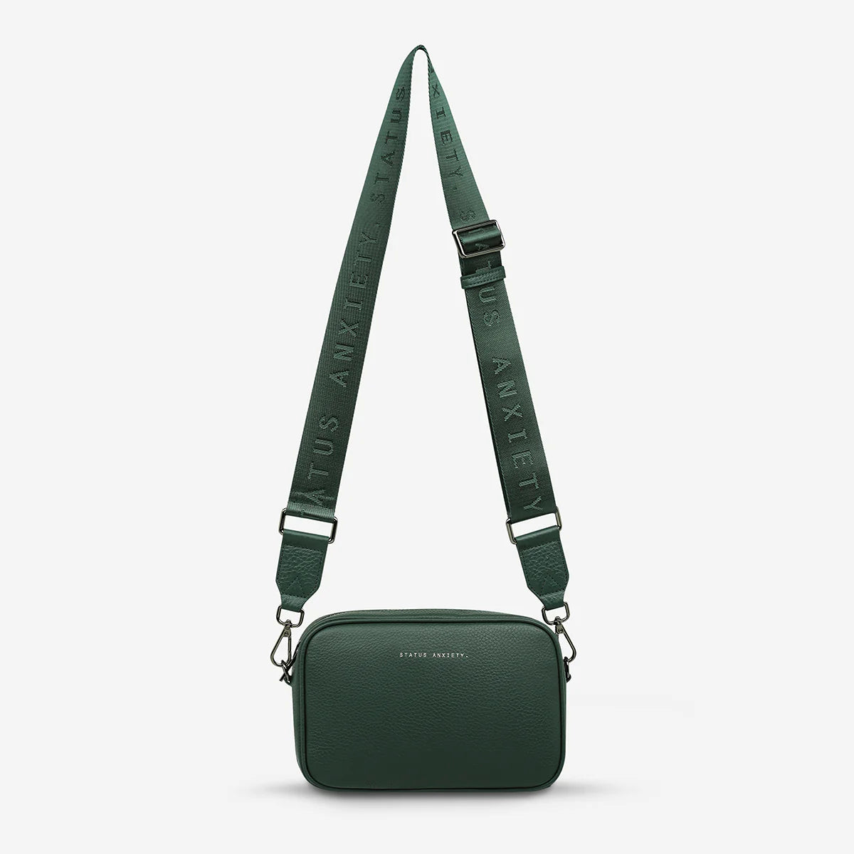 Plunder Bag With Dual Straps - Green - Status Anxiety 

Our best selling bag of all time now comes with two different straps for twice the versatility. Clip on the leather strap for dressier occasions, or the webbed strap for a more casual vibe. It's a no brainer.

Soft shrunken pebble leather
Comes with Leather Strap Thin & Web Strap Medium
Back slider pocket
Internal zipper pocket, and open pouch pockets
Zipper close
Custom Status Anxiety lining
Comes in a Status Anxiety branded drawstring bag
