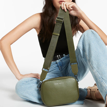 Plunder Bag With Dual Straps - Khaki - Status Anxiety 

Our best selling bag of all time now comes with two different straps for twice the versatility. Clip on the leather strap for dressier occasions, or the webbed strap for a more casual vibe. It's a no brainer.

Soft shrunken pebble leather
Comes with Leather Strap Thin & Web Strap Medium
Back slider pocket
Internal zipper pocket, and open pouch pockets
Zipper close
Custom Status Anxiety lining
Comes in a Status Anxiety branded drawstring bag