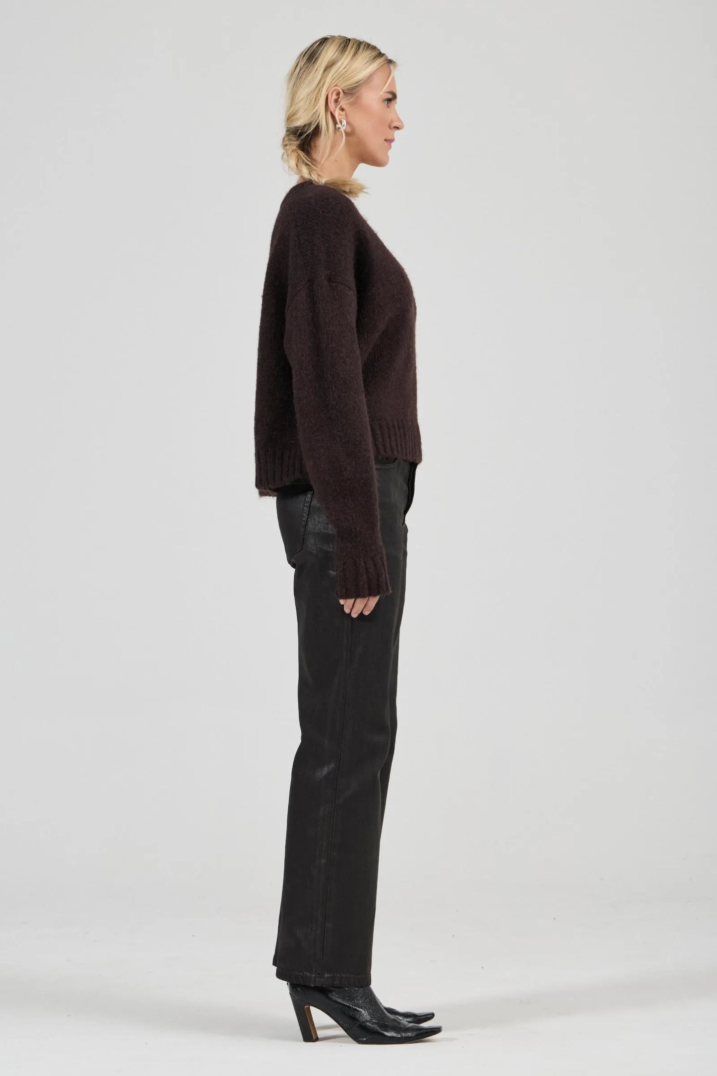 Effortlessly relaxed sweater with a slouchy, slightly oversized fit
Crafted from a luxuriously soft, brushed yarn blend with a touch of wool
Features a flattering deep V-neckline and dropped shoulders for comfort
Finished with chunky ribbed trims at the collar, cuffs, and hem
Rich espresso knit designed as an ideal layering piece
Provides a lived-in, effortlessly cool finish to your everyday look