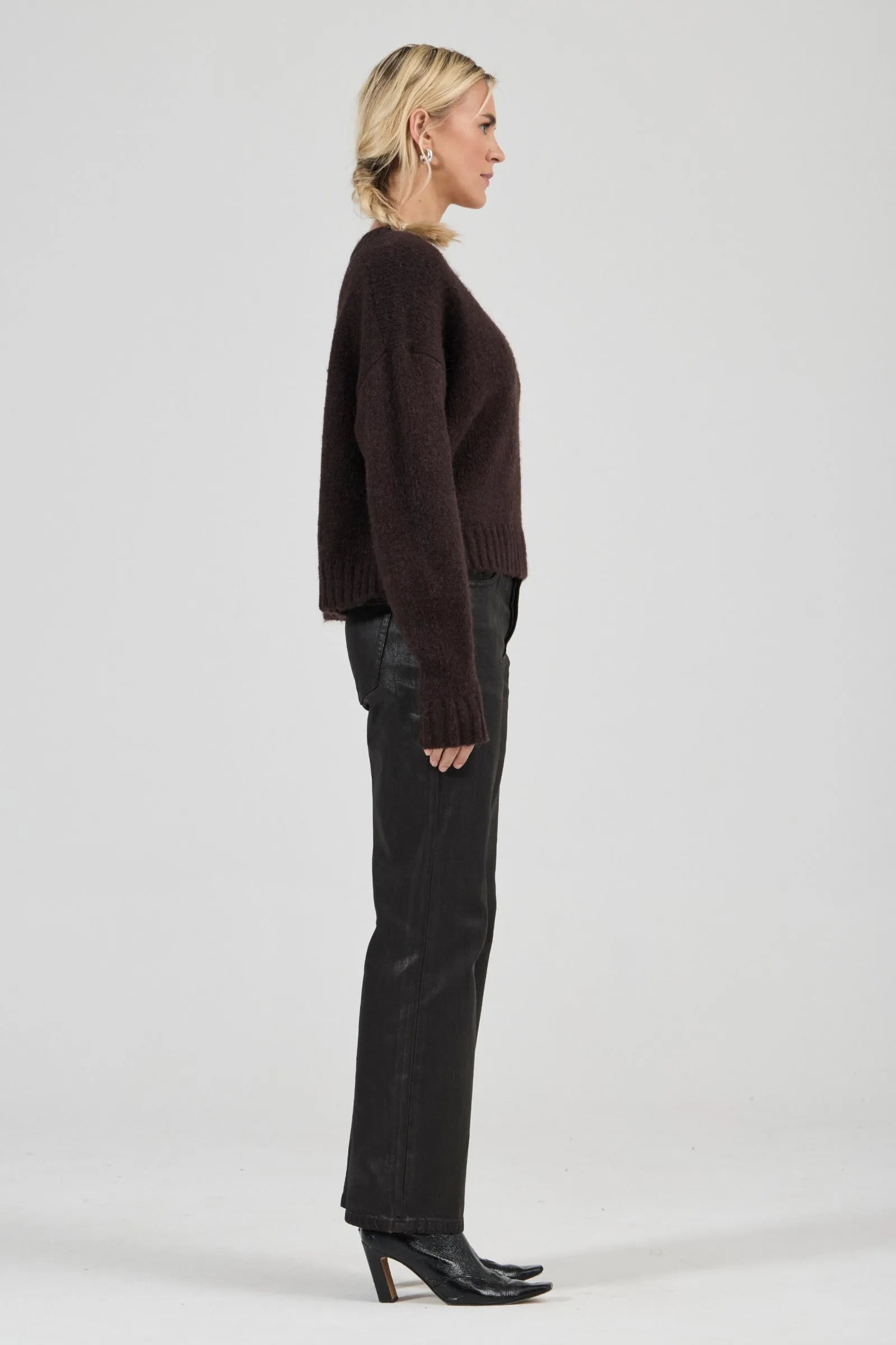 Effortlessly relaxed sweater with a slouchy, slightly oversized fit
Crafted from a luxuriously soft, brushed yarn blend with a touch of wool
Features a flattering deep V-neckline and dropped shoulders for comfort
Finished with chunky ribbed trims at the collar, cuffs, and hem
Rich espresso knit designed as an ideal layering piece
Provides a lived-in, effortlessly cool finish to your everyday look