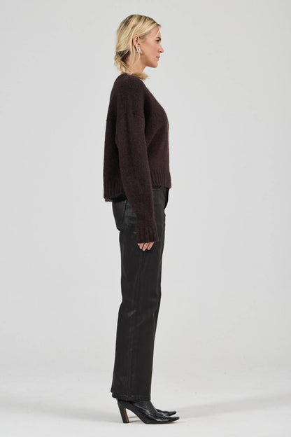 Effortlessly relaxed sweater with a slouchy, slightly oversized fit
Crafted from a luxuriously soft, brushed yarn blend with a touch of wool
Features a flattering deep V-neckline and dropped shoulders for comfort
Finished with chunky ribbed trims at the collar, cuffs, and hem
Rich espresso knit designed as an ideal layering piece
Provides a lived-in, effortlessly cool finish to your everyday look