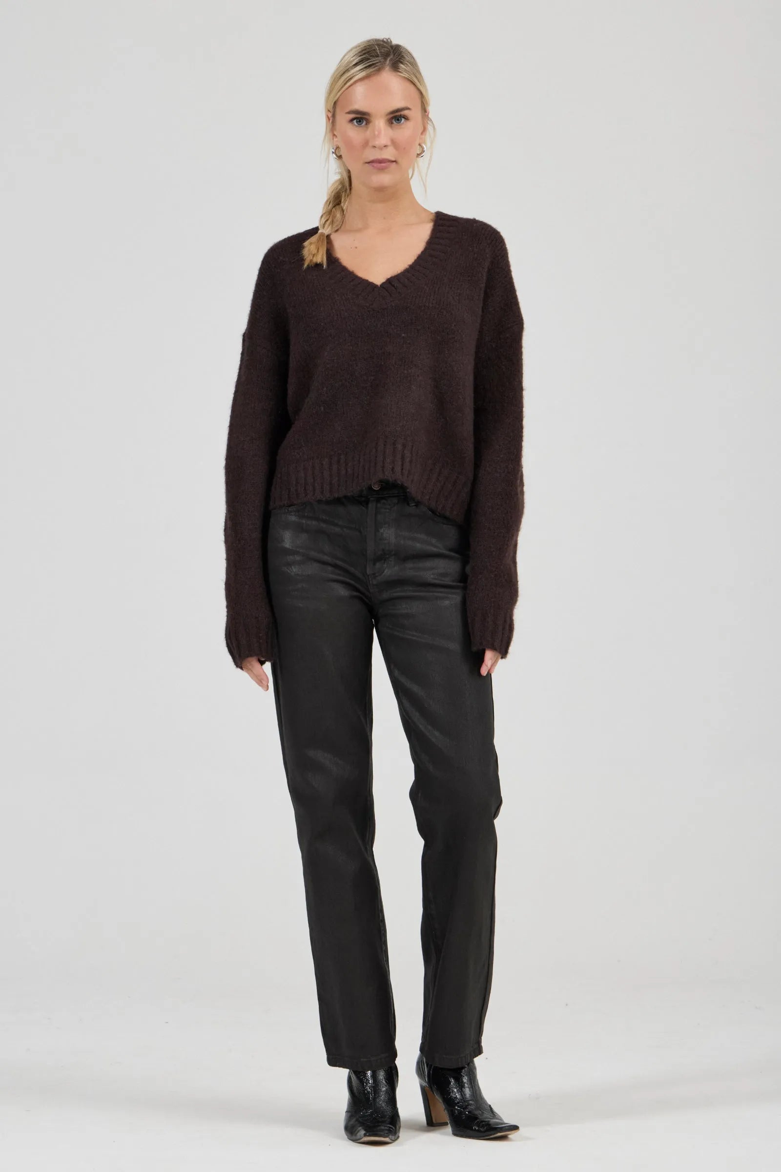 Effortlessly relaxed sweater with a slouchy, slightly oversized fit
Crafted from a luxuriously soft, brushed yarn blend with a touch of wool
Features a flattering deep V-neckline and dropped shoulders for comfort
Finished with chunky ribbed trims at the collar, cuffs, and hem
Rich espresso knit designed as an ideal layering piece
Provides a lived-in, effortlessly cool finish to your everyday look