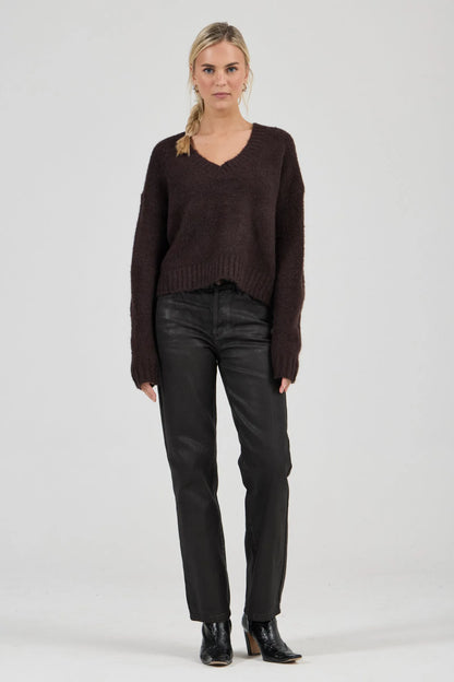 Effortlessly relaxed sweater with a slouchy, slightly oversized fit
Crafted from a luxuriously soft, brushed yarn blend with a touch of wool
Features a flattering deep V-neckline and dropped shoulders for comfort
Finished with chunky ribbed trims at the collar, cuffs, and hem
Rich espresso knit designed as an ideal layering piece
Provides a lived-in, effortlessly cool finish to your everyday look