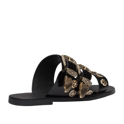 The best selling Eastwood slide takes the Western trend to new heights with statement buckles and cowboy inspired studs. Three prominent straps in a soft leather wrap the foot and sit atop a flattering almond shaped sole.